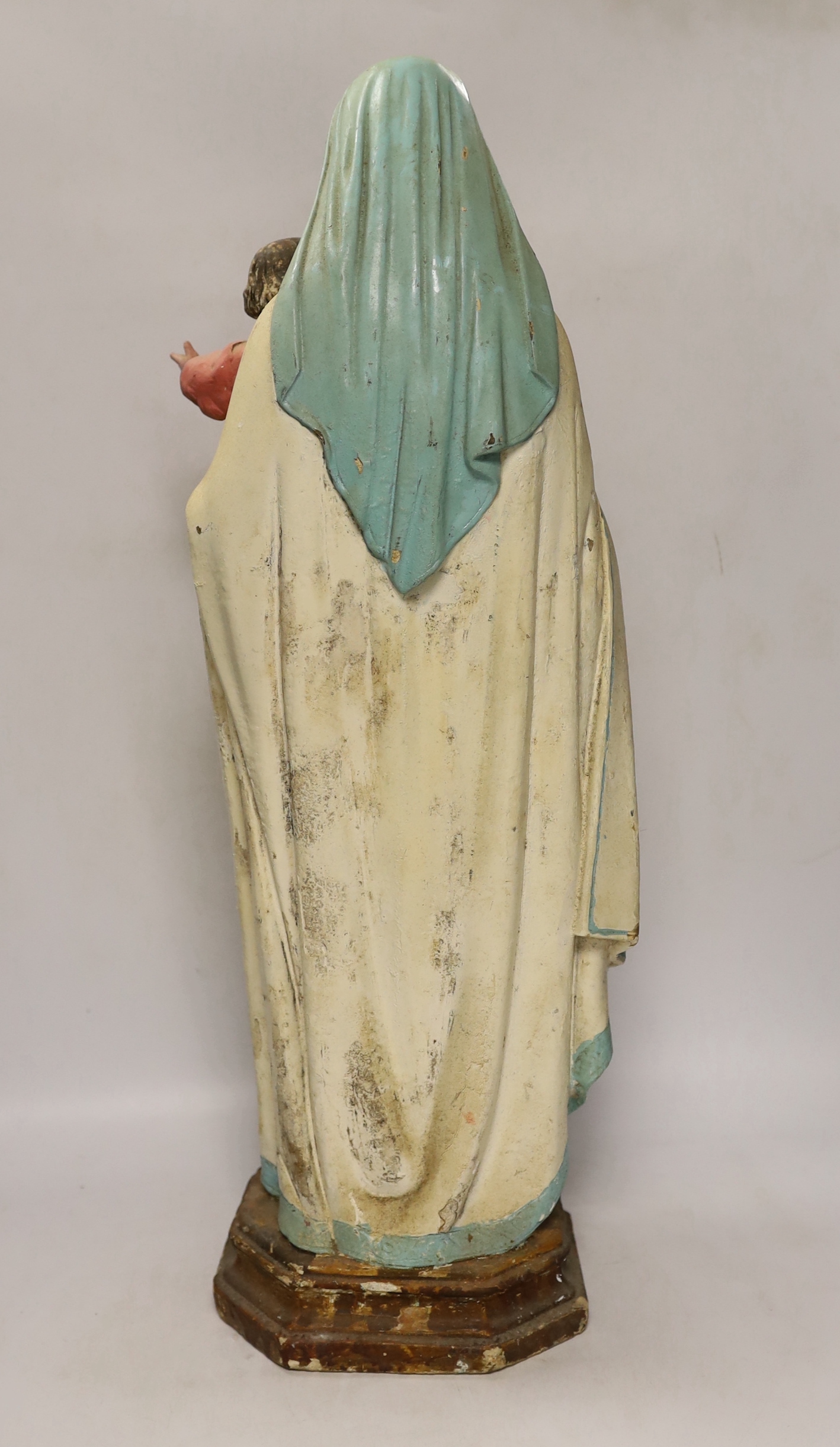 A painted plaster model of Madonna and child, 61cm high